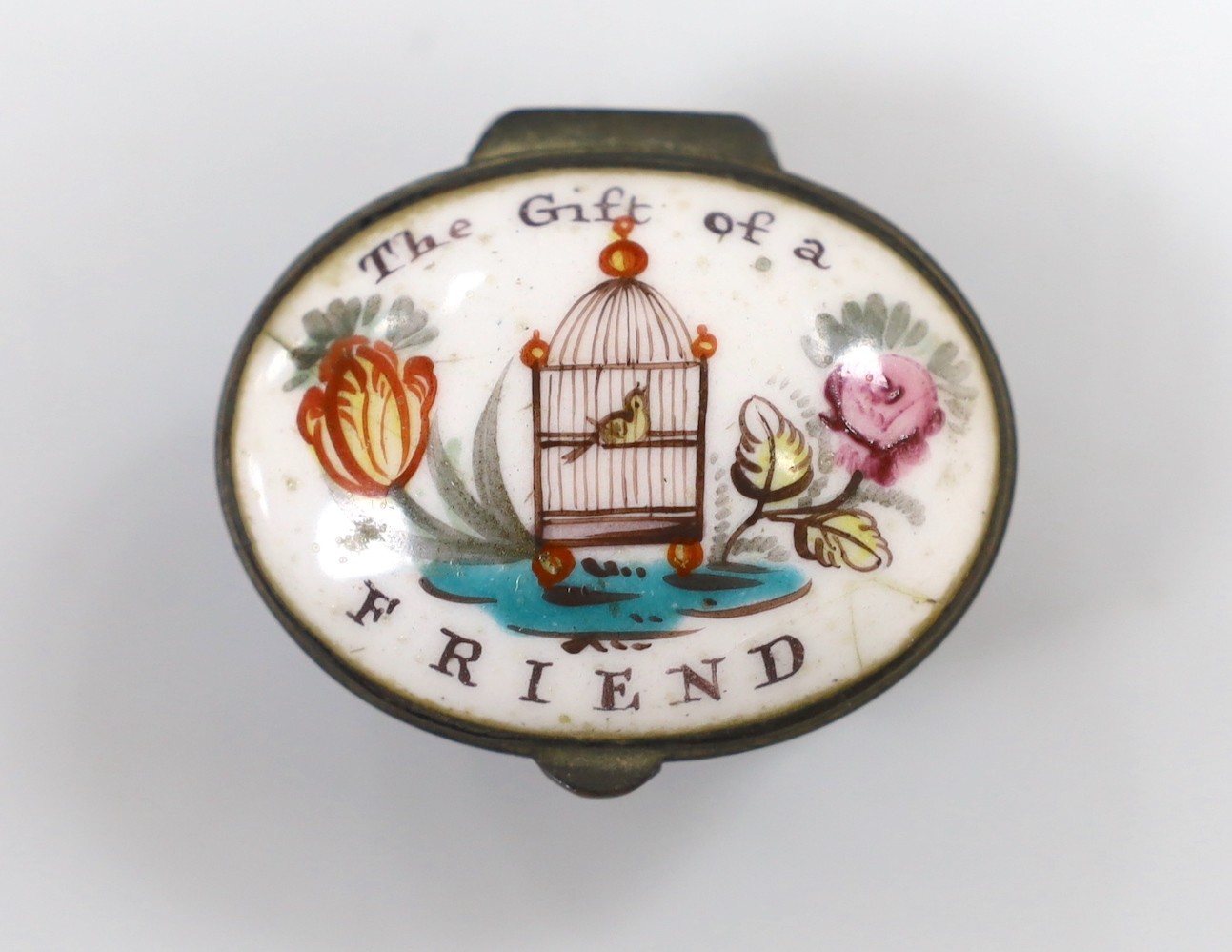 A small South Staffordshire enamel ‘Gift of a Friend’ patch box. 4.5cm wide
